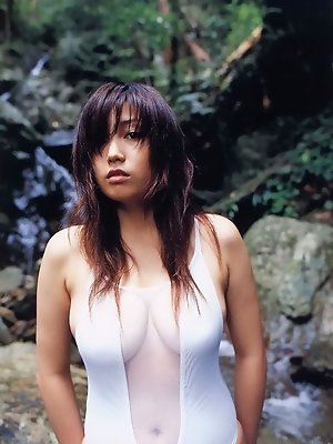 Seductive asian fox in a bikini with big soft round titties